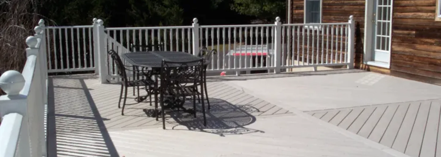 light gray deck with black patio table